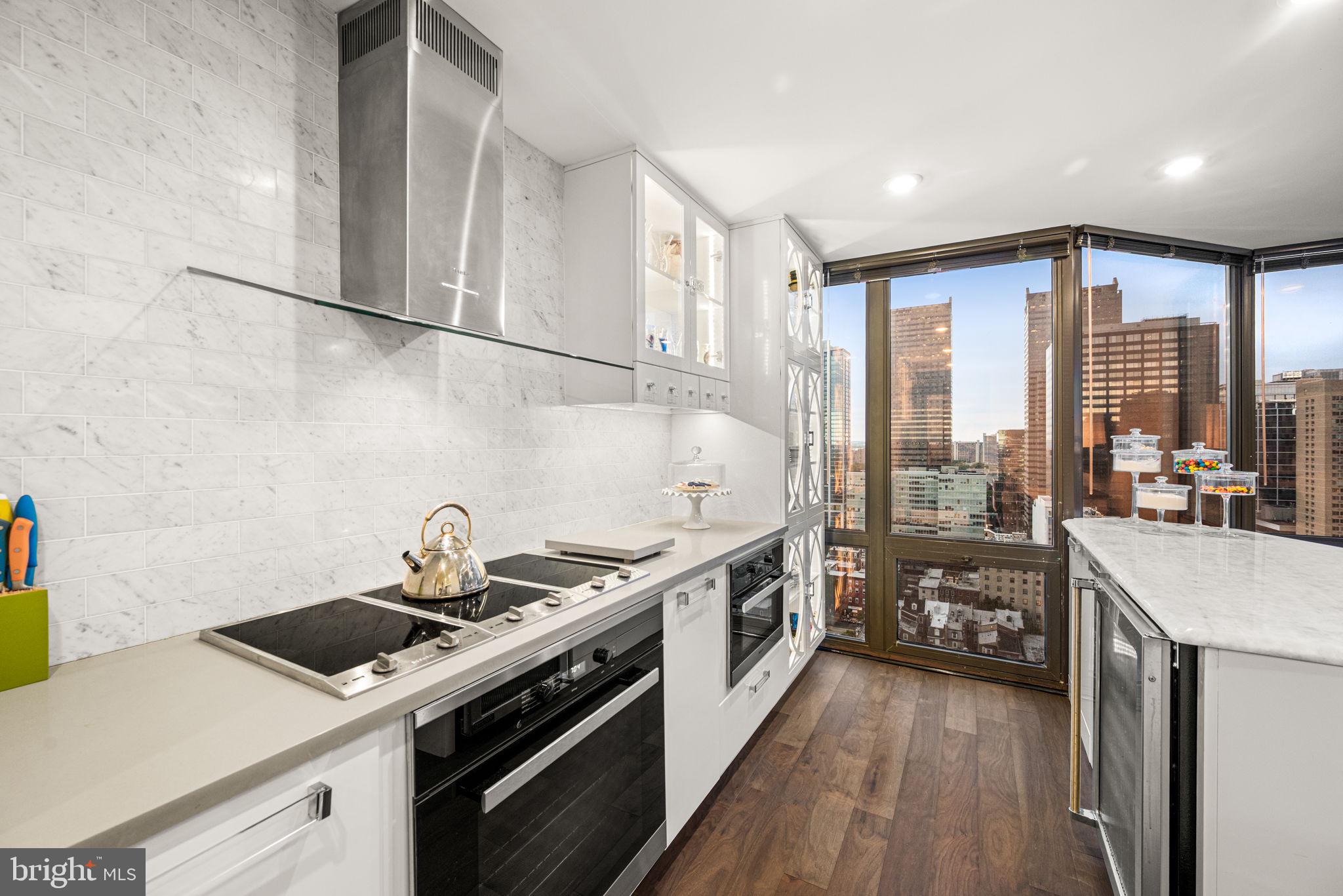 2020 Walnut Street, Unit 25B Philadelphia, PA 19103 - Photo 6 of 42 a kitchen with a stove and a wooden floors