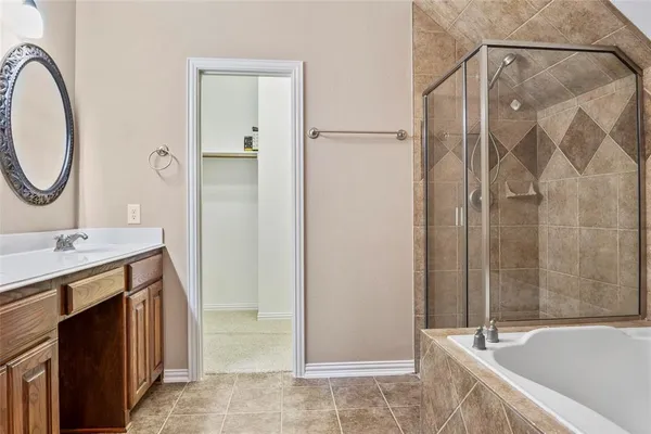 a bathroom with a tub and shower