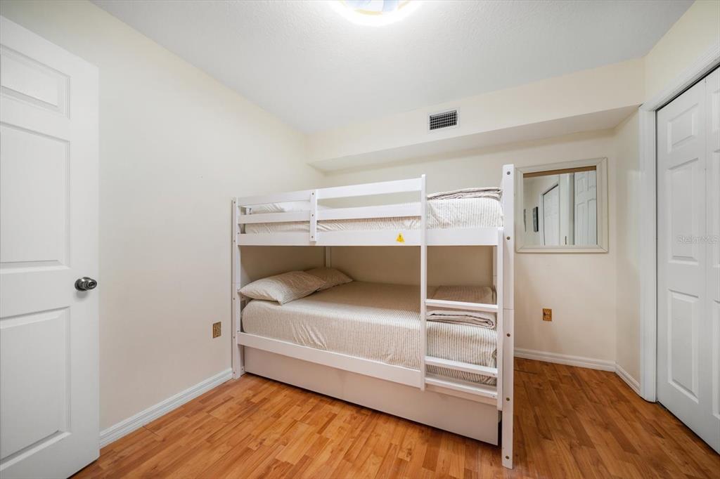 1500 Gulf Boulevard, Unit 103B Indian Rocks Beach, FL 33785 - Photo 21 of 58 a view of an empty room with wooden floor
