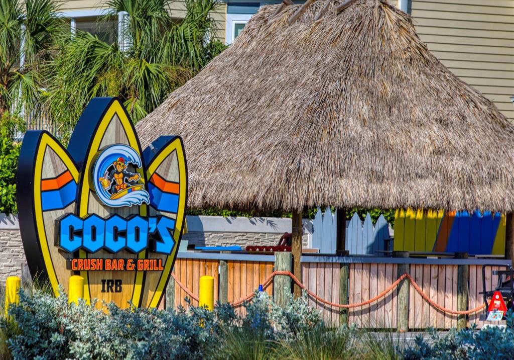 1500 Gulf Boulevard, Unit 103B Indian Rocks Beach, FL 33785 - Photo 44 of 58 swimming pool with outdoor seating and garden