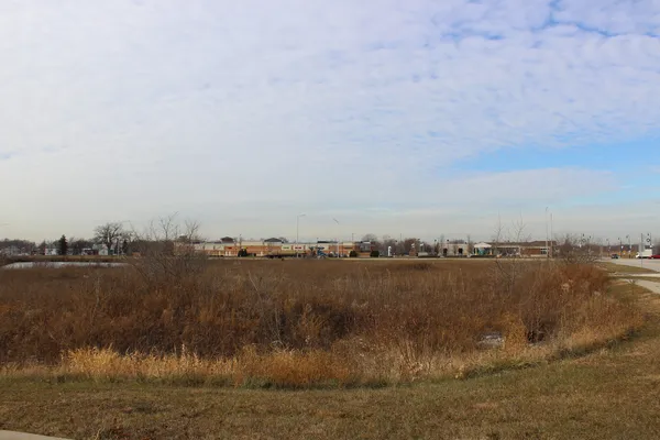 a view of a lake and city in the back