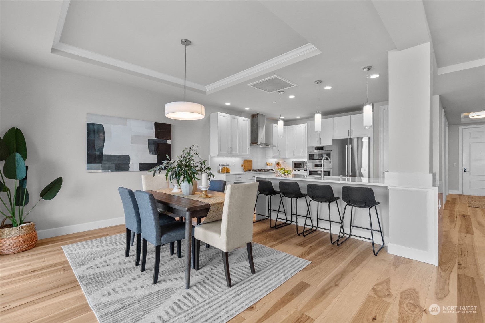 4907 Main Street, Unit 508 Tacoma, WA 98407 - Photo 13 of 40 a view of a dining room with furniture and wooden floor