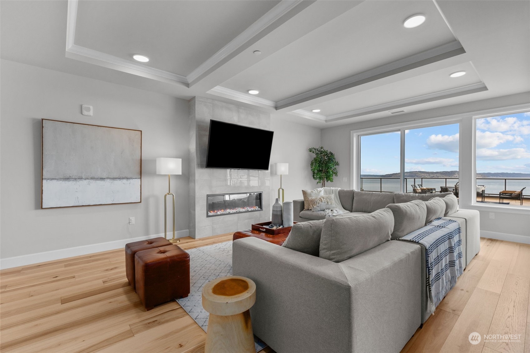 4907 Main Street, Unit 508 Tacoma, WA 98407 - Photo 2 of 40 a living room with furniture and a flat screen tv