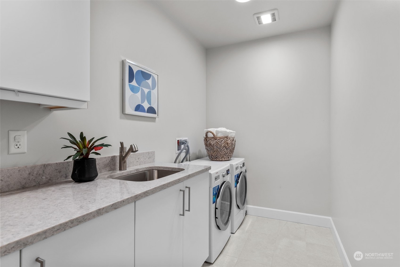 4907 Main Street, Unit 508 Tacoma, WA 98407 - Photo 21 of 40 a kitchen with a sink a stove and cabinets