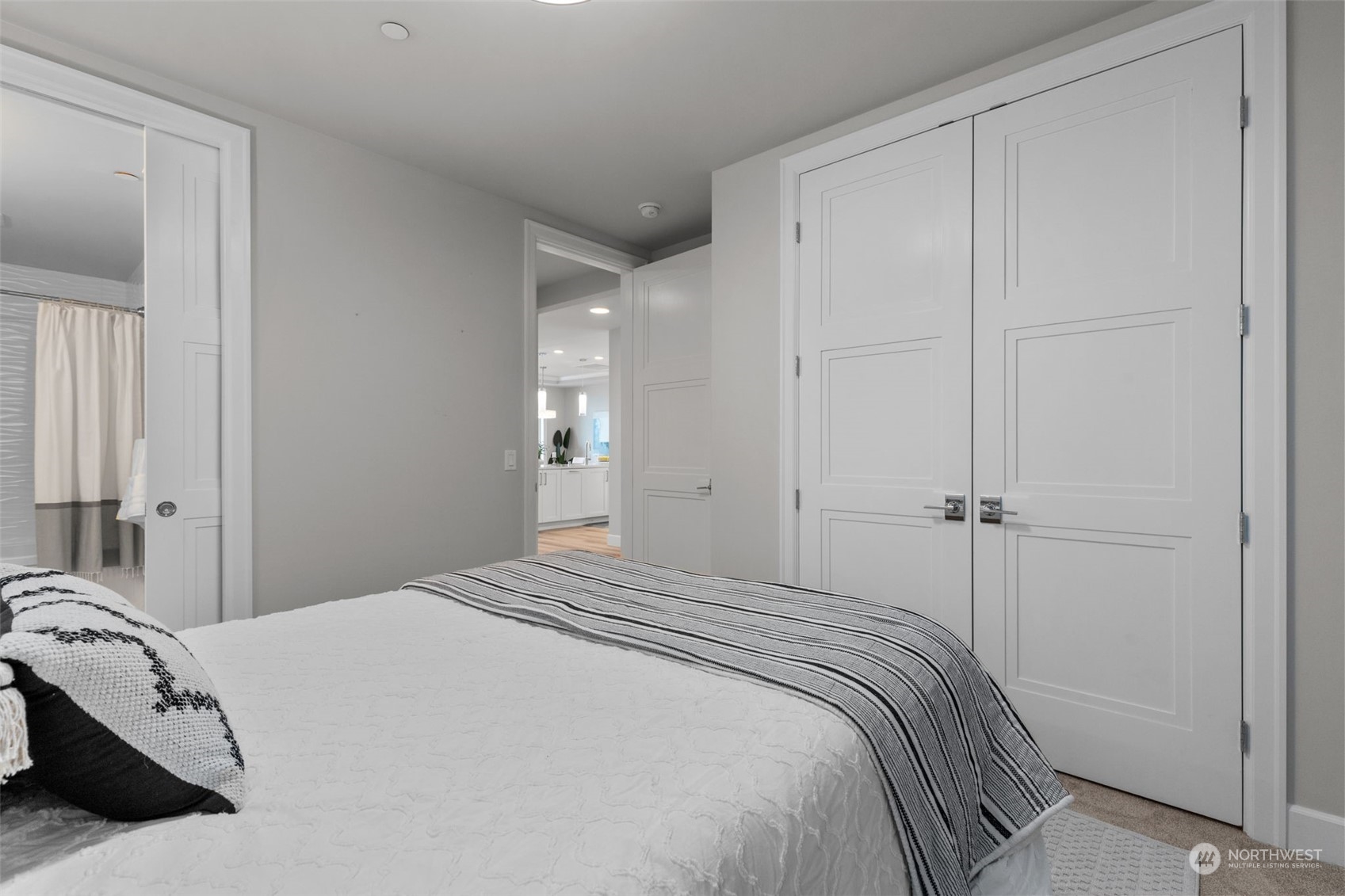 4907 Main Street, Unit 508 Tacoma, WA 98407 - Photo 23 of 40 a bedroom with a bed and a mirror