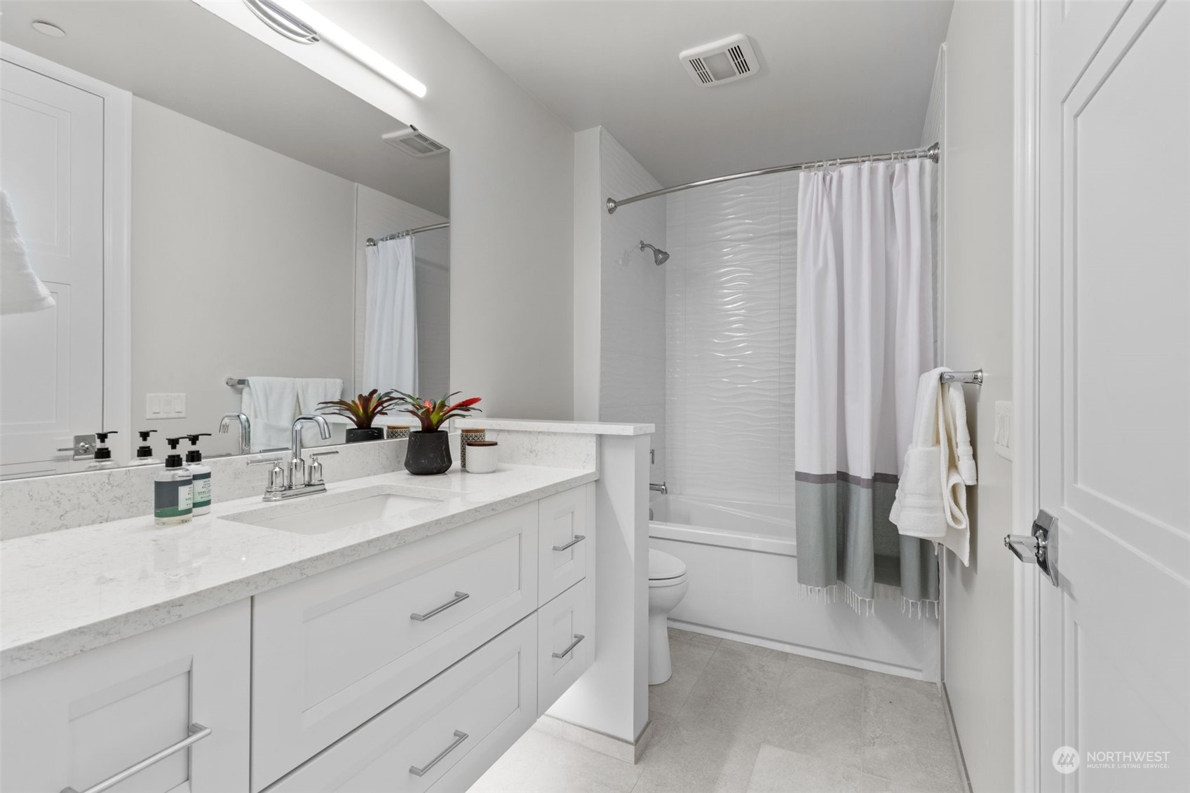 4907 Main Street, Unit 508 Tacoma, WA 98407 - Photo 24 of 40 a bathroom with a double vanity sink mirror and double