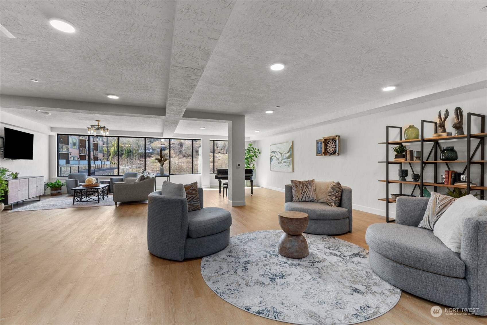 4907 Main Street, Unit 508 Tacoma, WA 98407 - Photo 31 of 40 a living room with furniture and a flat screen tv