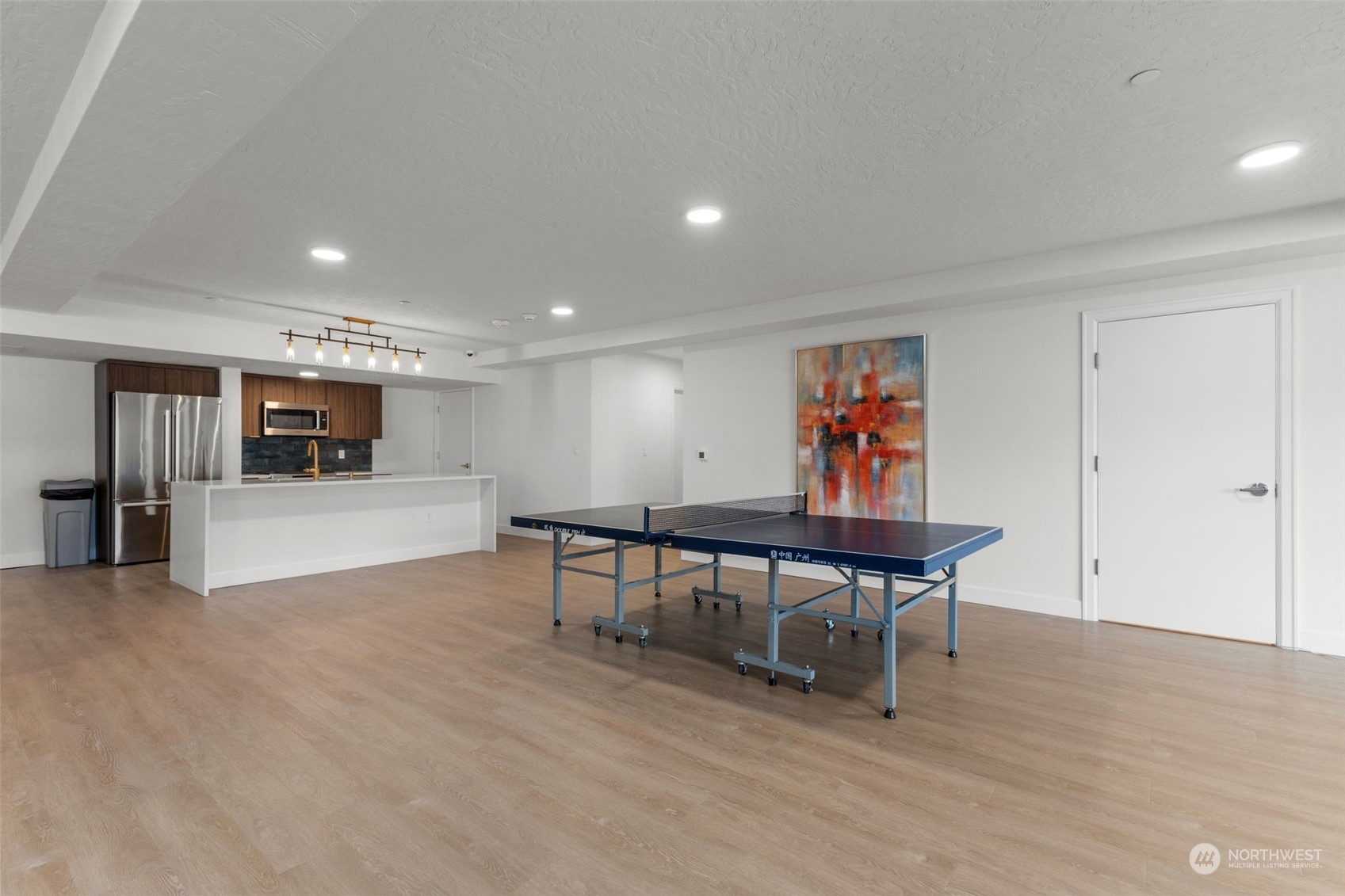 4907 Main Street, Unit 508 Tacoma, WA 98407 - Photo 32 of 40 a view of a room with furniture and wooden floor