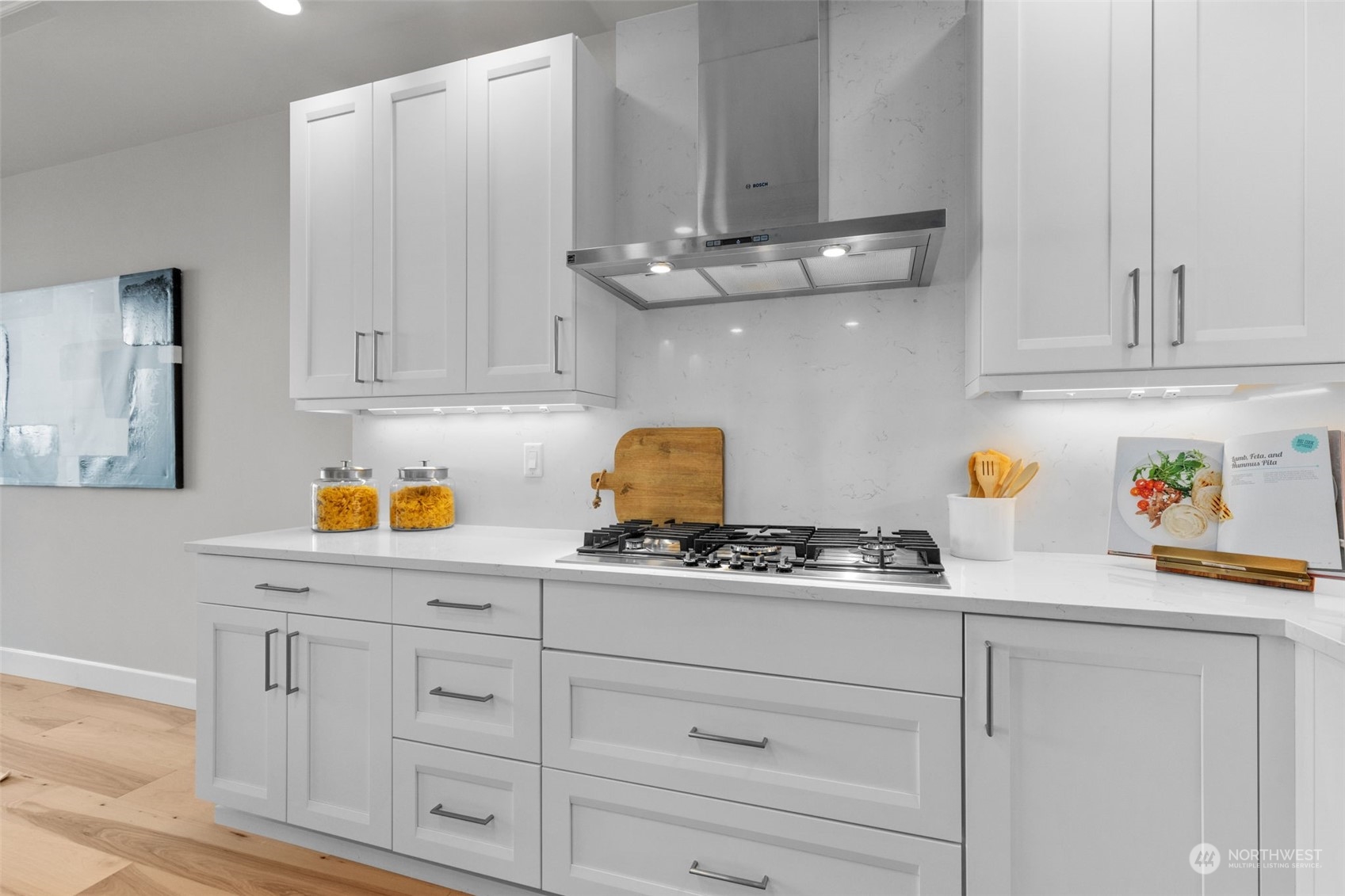4907 Main Street, Unit 508 Tacoma, WA 98407 - Photo 9 of 40 a kitchen with white cabinets and appliances