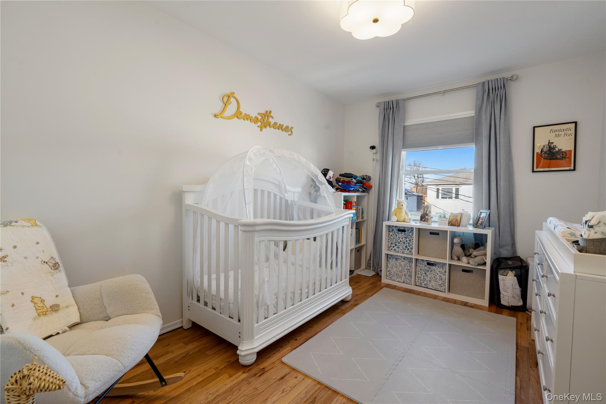 208-48 15th Road, Unit 2 Queens, NY 11360 - Photo 21 of 23 Bedroom featuring a nursery area and light wood finished floors