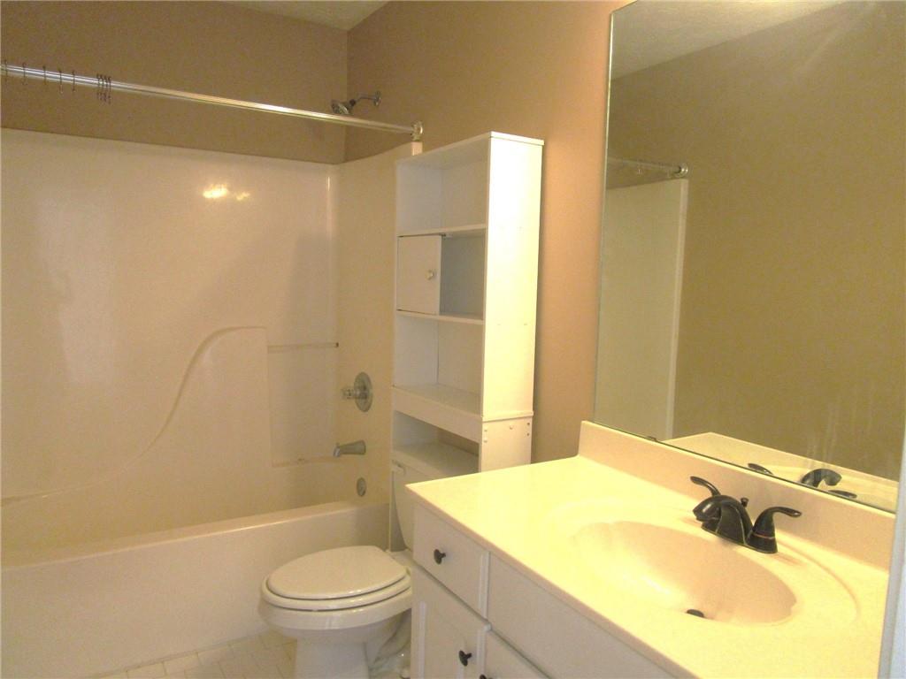 2825 Factor Walk Boulevard Suwanee, GA 30024 - Photo 21 of 25 a bathroom with a sink toilet and shower