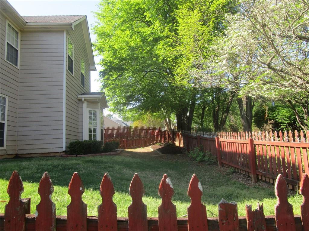 2825 Factor Walk Boulevard Suwanee, GA 30024 - Photo 25 of 25 a view of a house with backyard and a patio