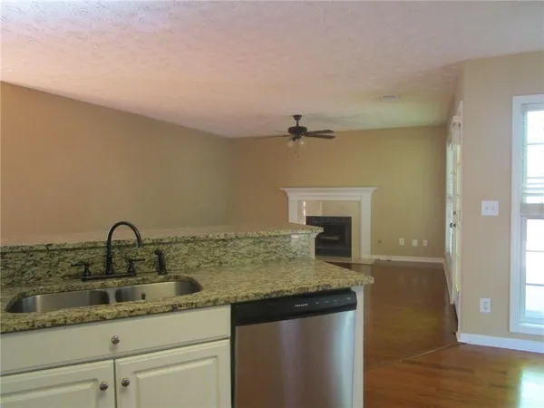 a kitchen with a sink and a stove