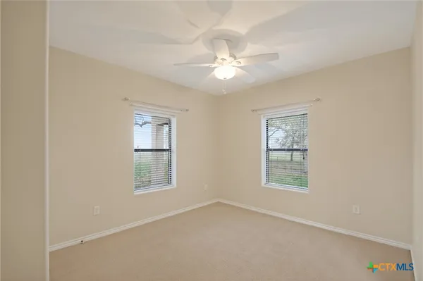 a view of a livingroom with furniture and a window