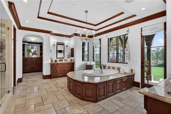 a bedroom with two beds and painting on the wall