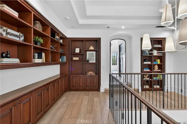 a view of a patio with a table and chairs under an umbrella with wooden fence