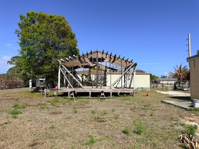 7645 129th Street Sebastian, FL 32958 - Photo 2 of 9 a white house that has a tree in front of it