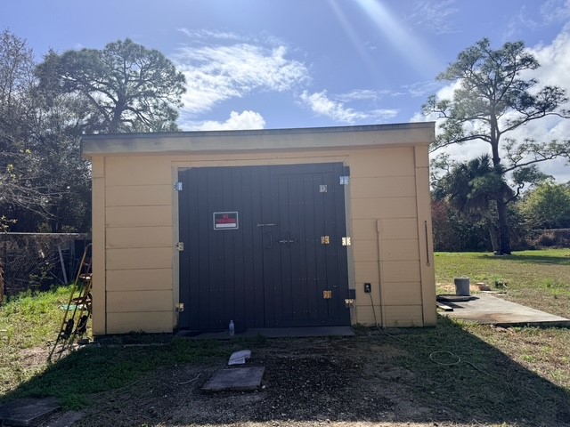 7645 129th Street Sebastian, FL 32958 - Photo 4 of 9 a view of a back yard of the house