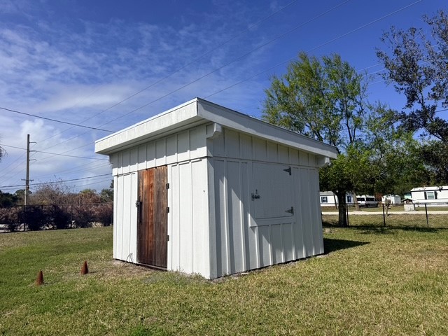 7645 129th Street Sebastian, FL 32958 - Photo 8 of 9 a view of a house with a yard