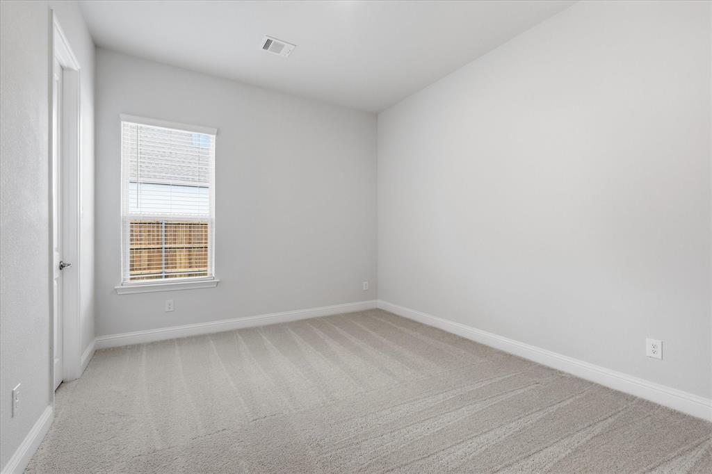 4017 Alpine Street Midlothian, TX 76065 - Photo 30 of 37 Carpeted room featuring a single window with horizontal blinds, white trim, and light-toned walls