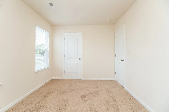 an empty room with windows