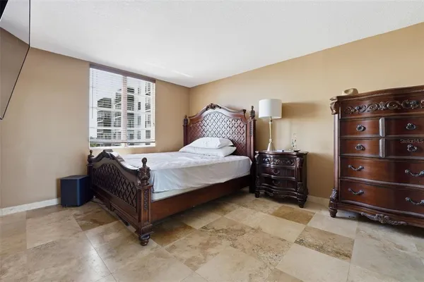 a bedroom with a bed and a walk in closet