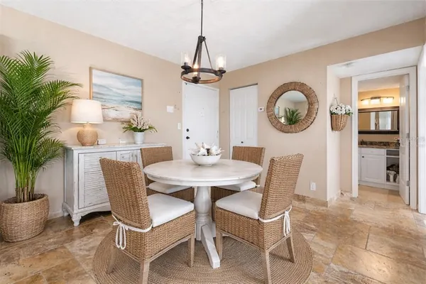 a kitchen with granite countertop wooden cabinets and a stove