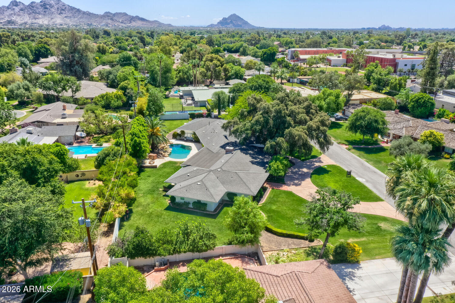 330 West Lawrence Road Phoenix, AZ 85013 - Photo 34 of 36 an aerial view of a houses with a lush green hillside