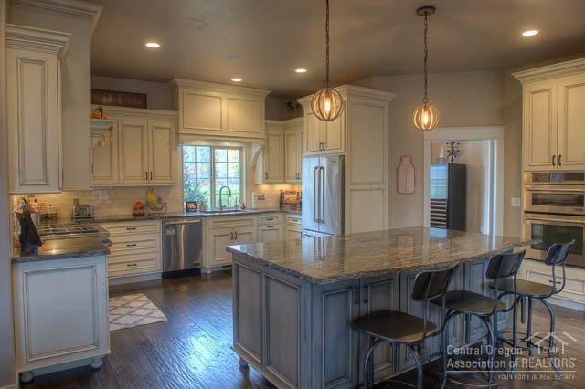 60570 Woodside Road Bend, OR 97702 - Photo 6 of 23 The kitchen features extensive custom ca
