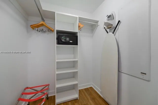 a white bath tub sitting next to a toilet