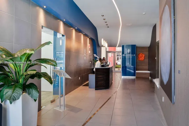 a living room with furniture a rug and a large window