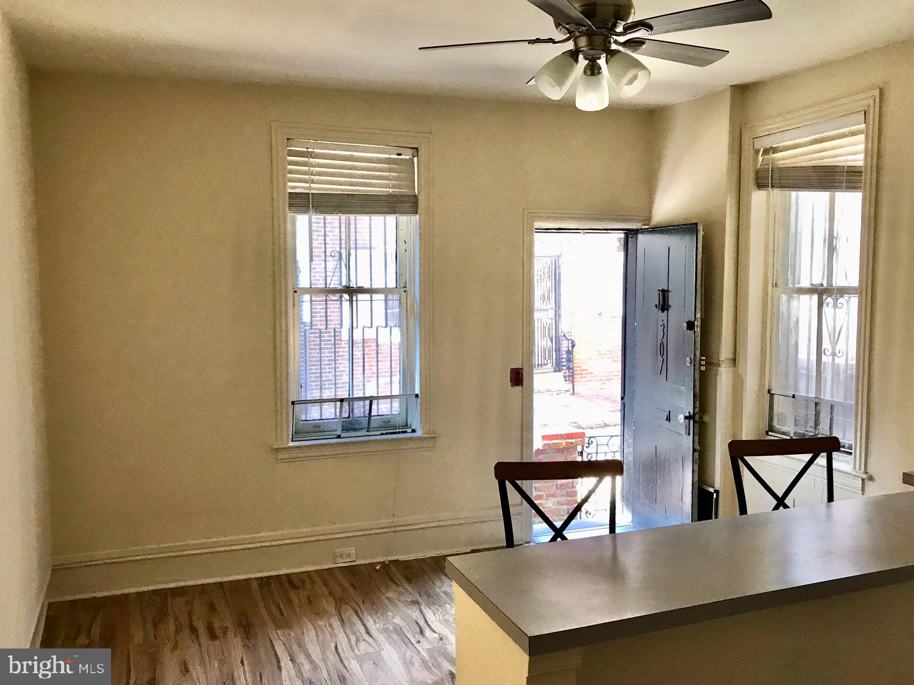 312 South 12th Street, Unit 1RR Philadelphia, PA 19107 - Photo 6 of 13 a view of a livingroom with furniture and window