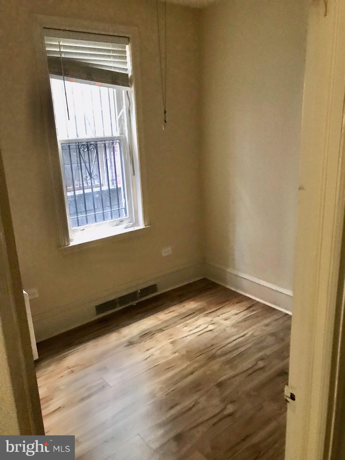 312 South 12th Street, Unit 1RR Philadelphia, PA 19107 - Photo 8 of 13 a view of an empty room and window