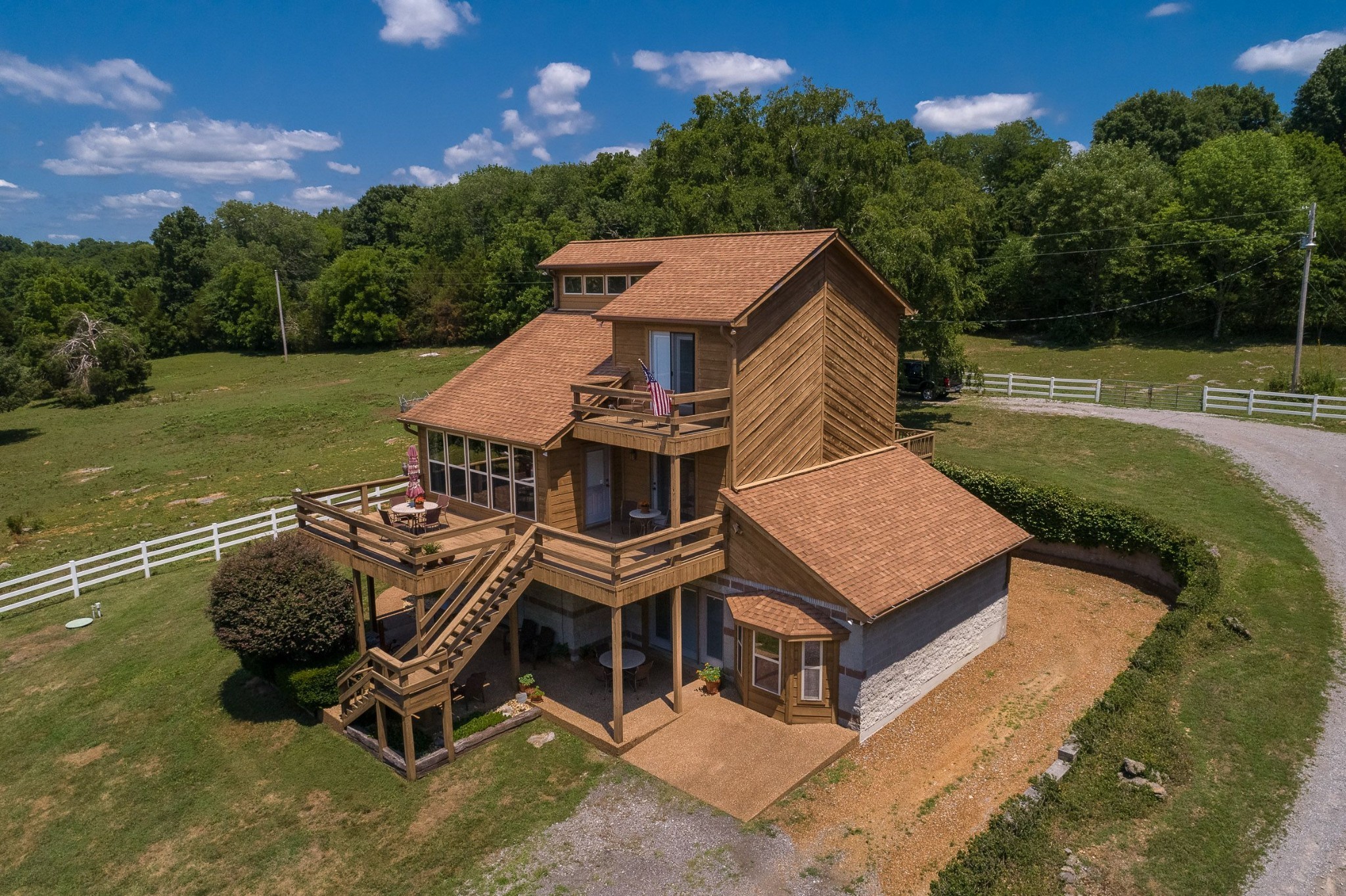 649 Lock 5 Road Lebanon, TN 37087 - Photo 1 of 65 an aerial view of a house with swimming pool garden and mountain view in back