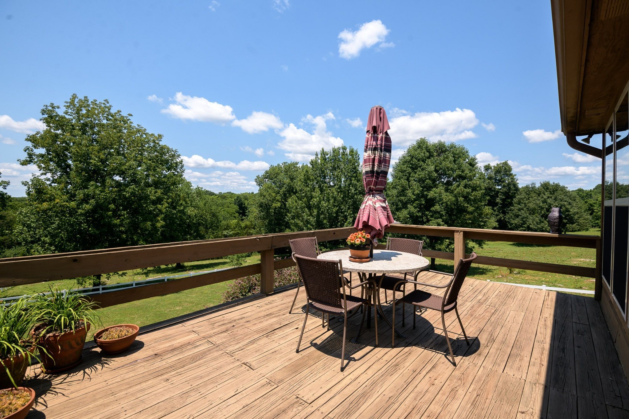 649 Lock 5 Road Lebanon, TN 37087 - Photo 12 of 65 a roof deck with table and chairs potted plants with wooden floor and fence