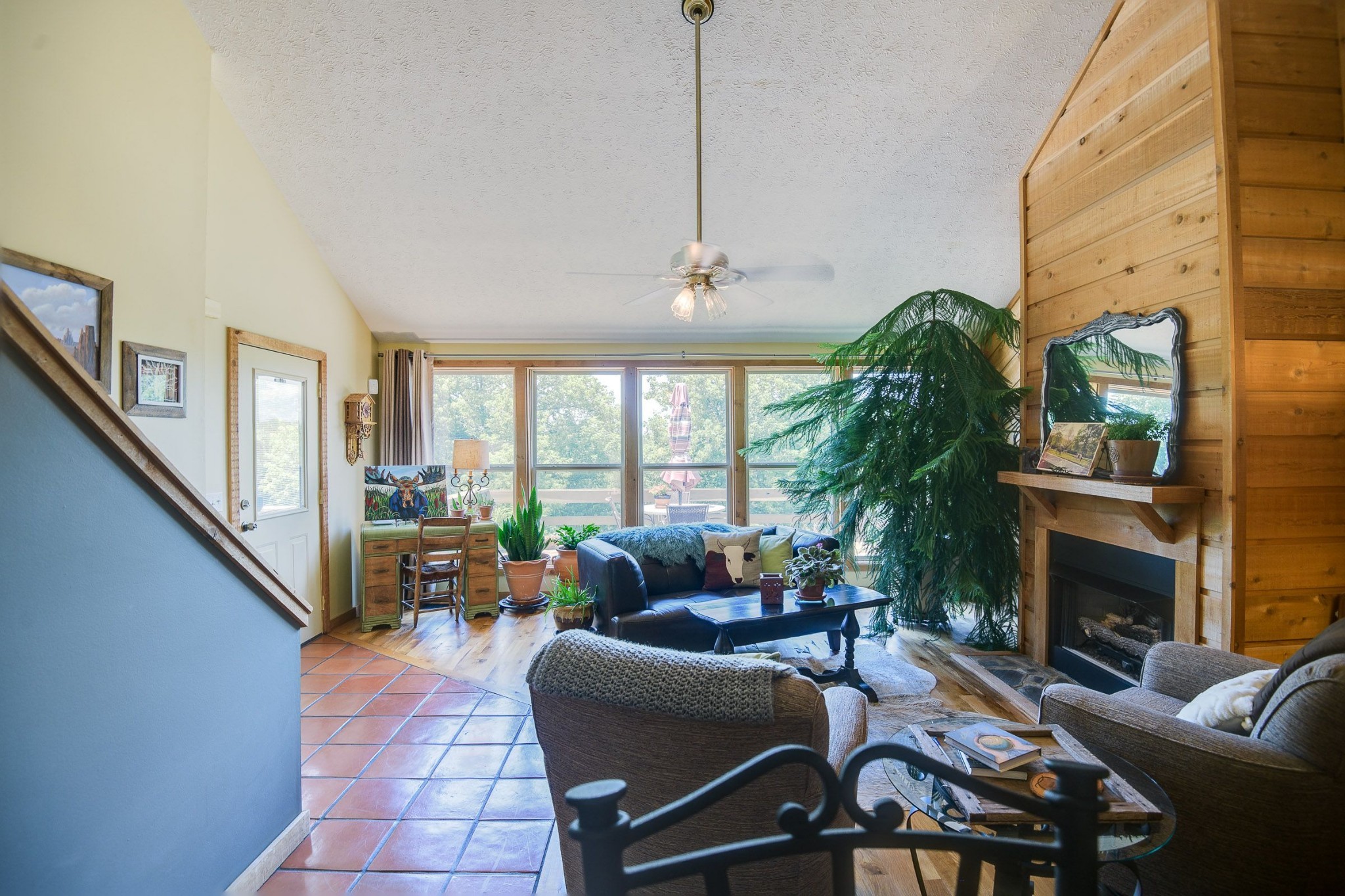 649 Lock 5 Road Lebanon, TN 37087 - Photo 20 of 65 a living room with furniture a fireplace and a floor to ceiling window