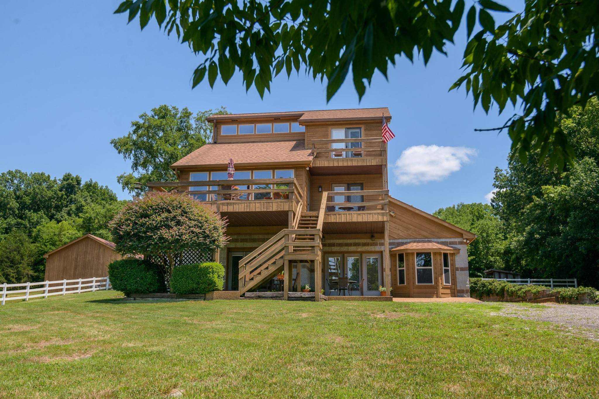 649 Lock 5 Road Lebanon, TN 37087 - Photo 2 of 65 a front view of a house with a garden