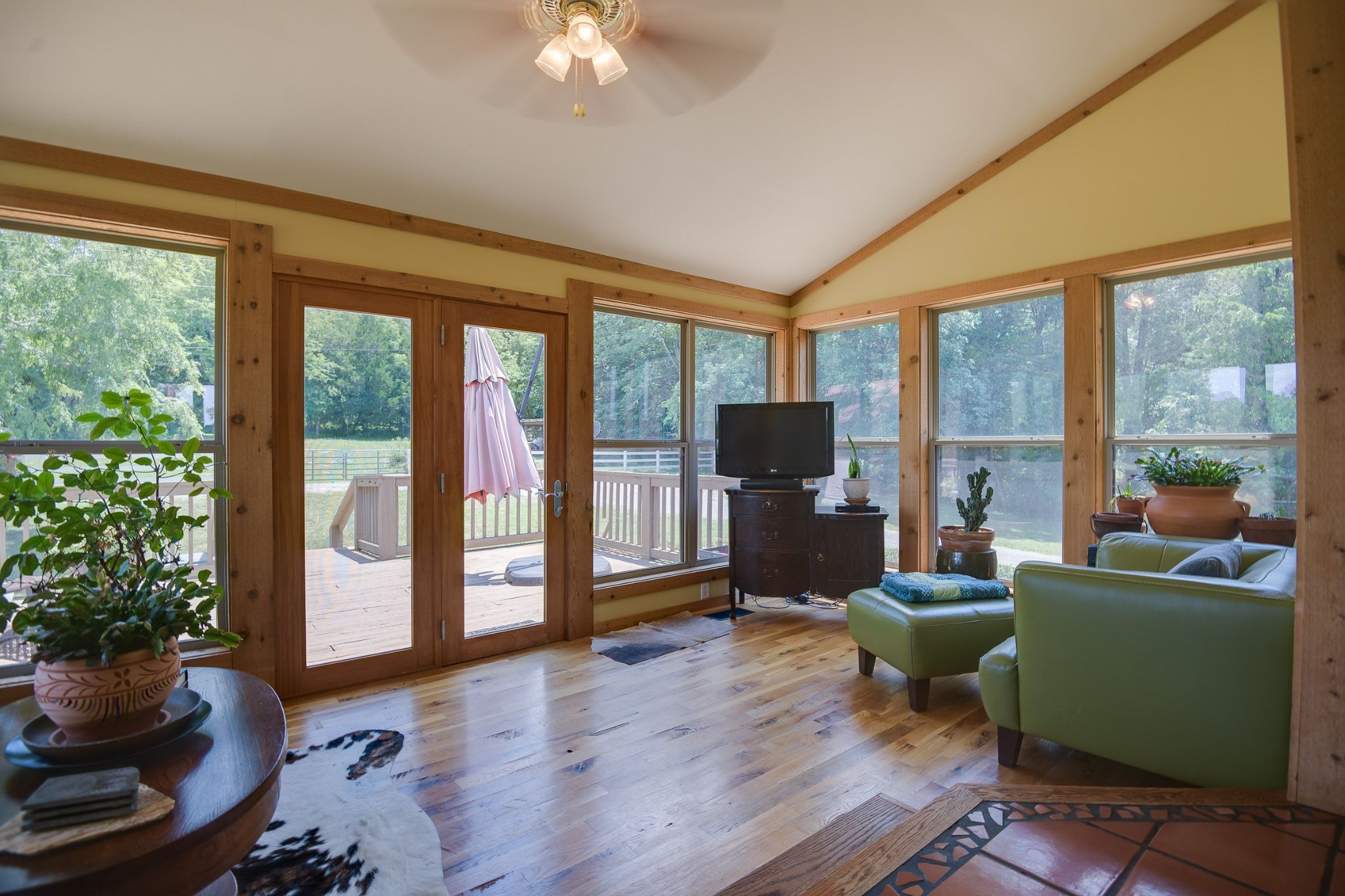 649 Lock 5 Road Lebanon, TN 37087 - Photo 29 of 65 a living room with furniture a flat screen tv and a floor to ceiling window