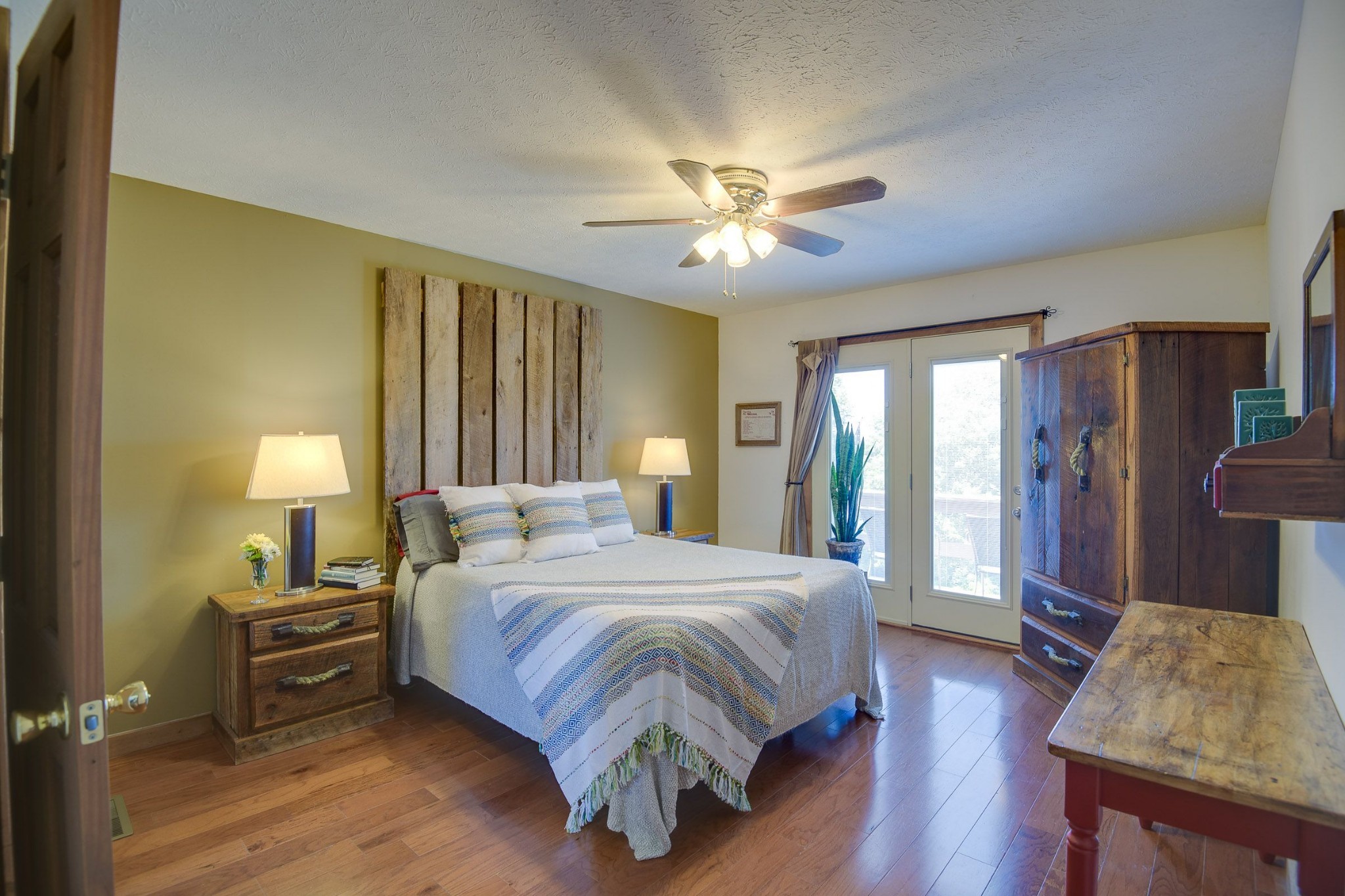 649 Lock 5 Road Lebanon, TN 37087 - Photo 37 of 65 a bedroom with a bed and a chandelier