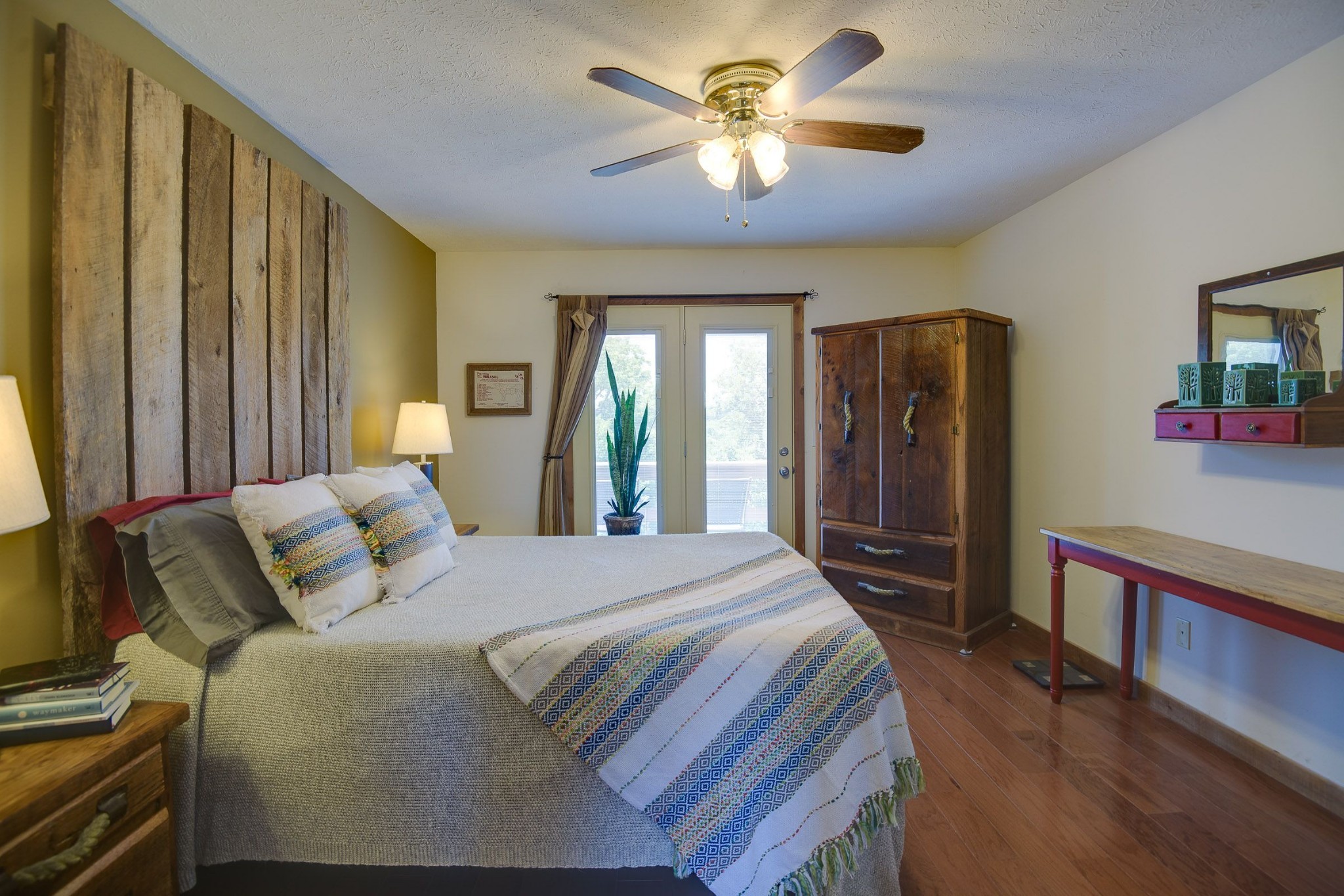 649 Lock 5 Road Lebanon, TN 37087 - Photo 38 of 65 a bedroom with a large bed and a chandelier