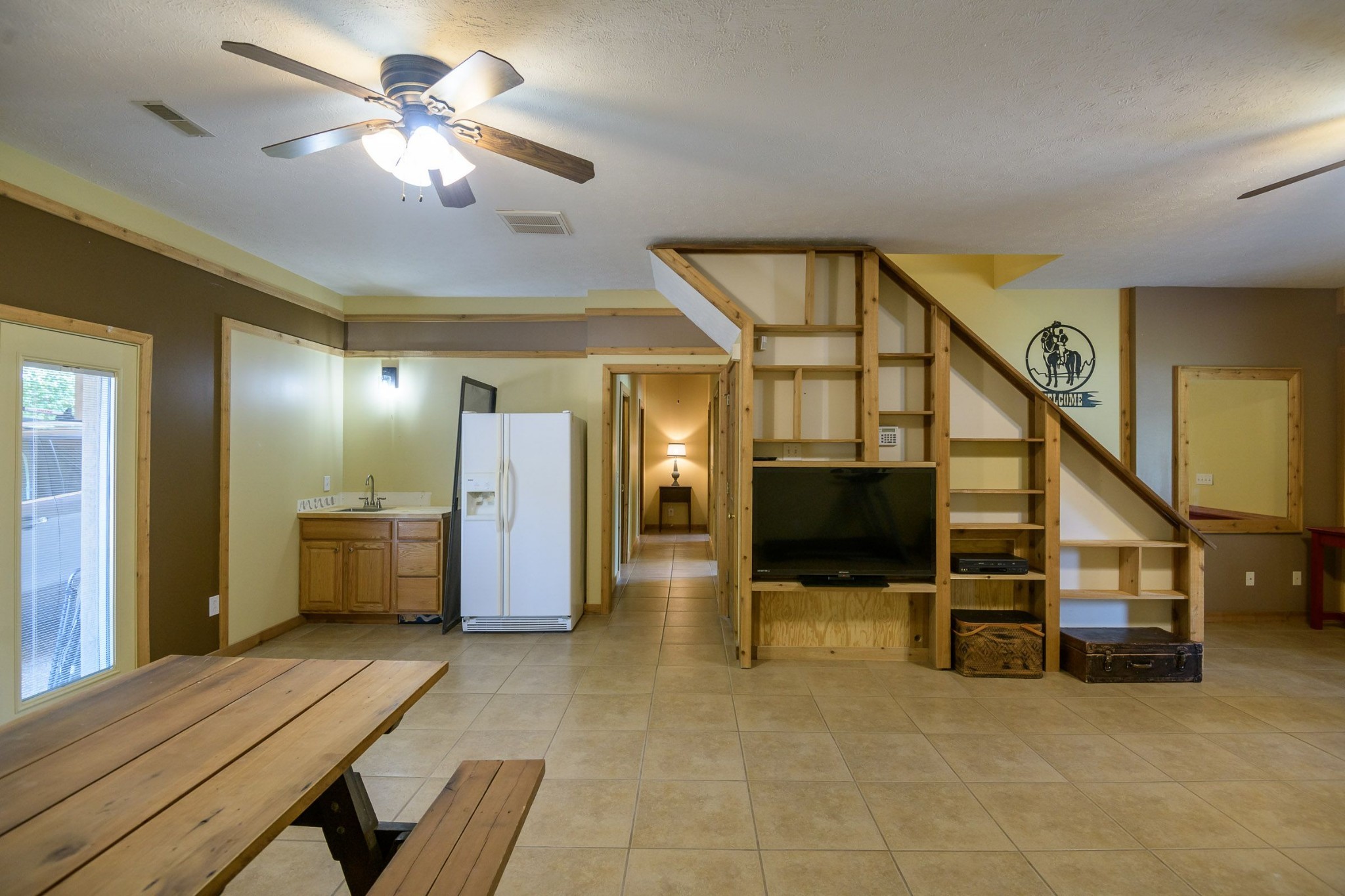 649 Lock 5 Road Lebanon, TN 37087 - Photo 46 of 65 a view of a livingroom with furniture stairs and a chandelier fan