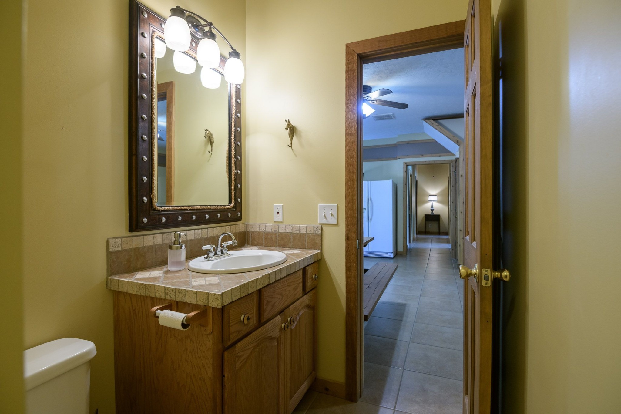 649 Lock 5 Road Lebanon, TN 37087 - Photo 49 of 65 a bathroom with a sink and a mirror