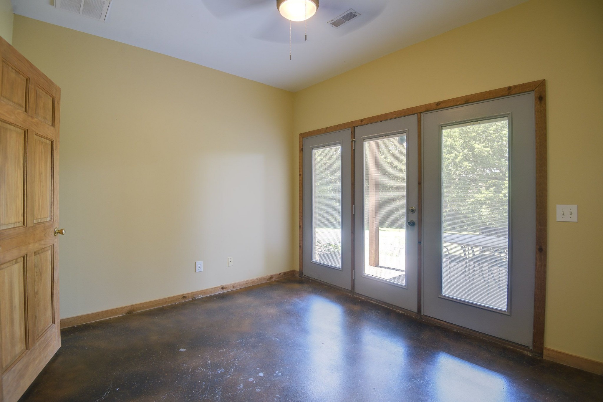 649 Lock 5 Road Lebanon, TN 37087 - Photo 51 of 65 a view of an empty room with a window and wooden floor