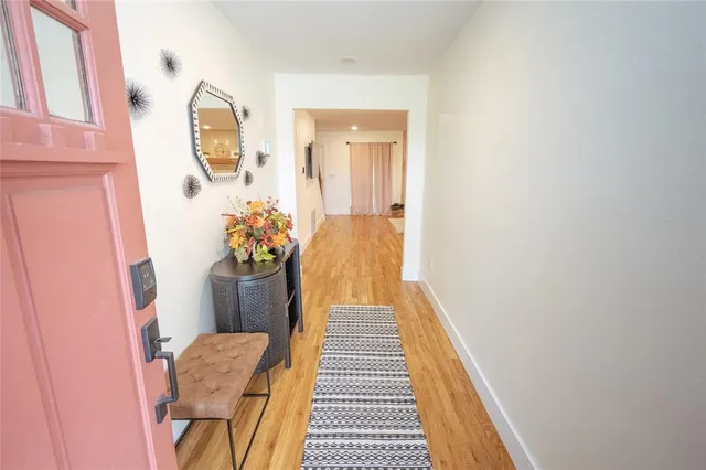 a large kitchen with kitchen island a sink a center island stainless steel appliances and a counter top space