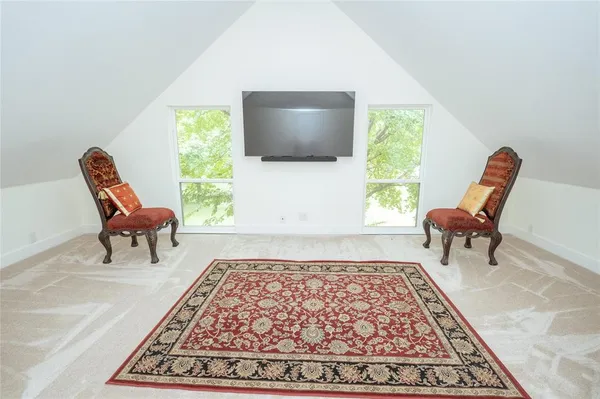 a car parked in front of a house with a yard