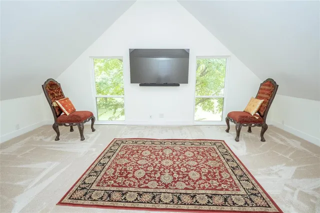 a car parked in front of a house with a yard