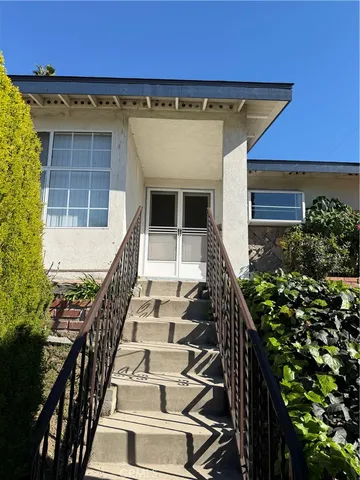 a view of entryway with a front door