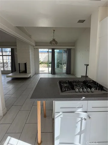 a kitchen with a stove a sink and a refrigerator
