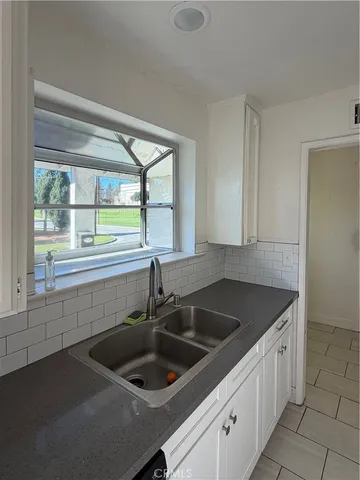 a kitchen with a sink and a window