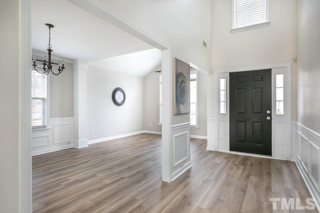 5400 Cahaba Way Raleigh, NC 27616 - Photo 1 of 13 A NEUTRAL PAINTED Entry Way, Living Room and Dining Room with NEW LUXURY VINYL PLANK FLOORING has direct access to the Kitchen, Family Room and backyard through a glass door and large windows that flood the home with TONS OF NATURAL LIGHT!